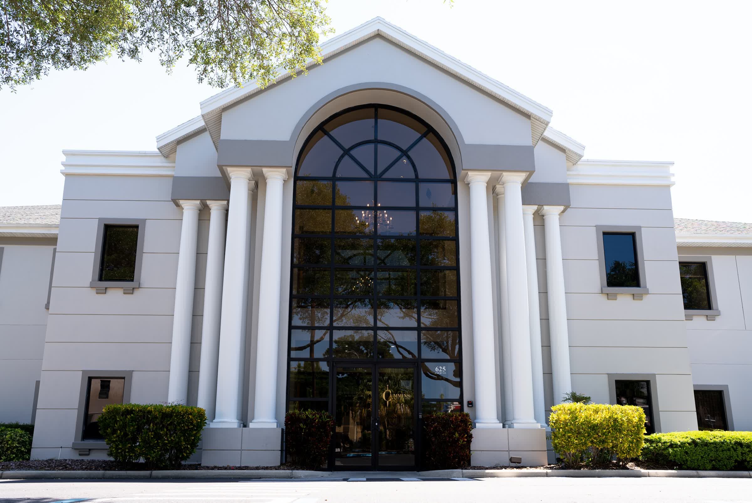 The white columned facade of Tom Cummins headquarters in Florida.
