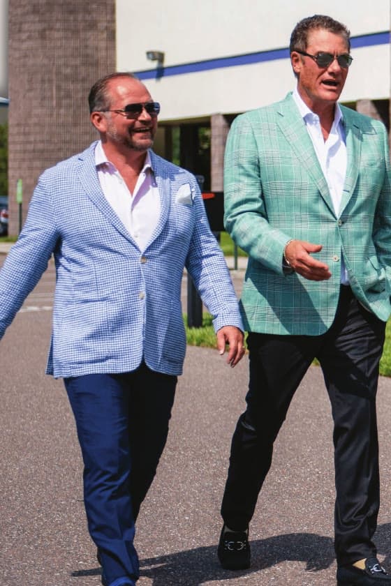 Tom and Jim Bridgeforth walking outside the American Power & Gas offices